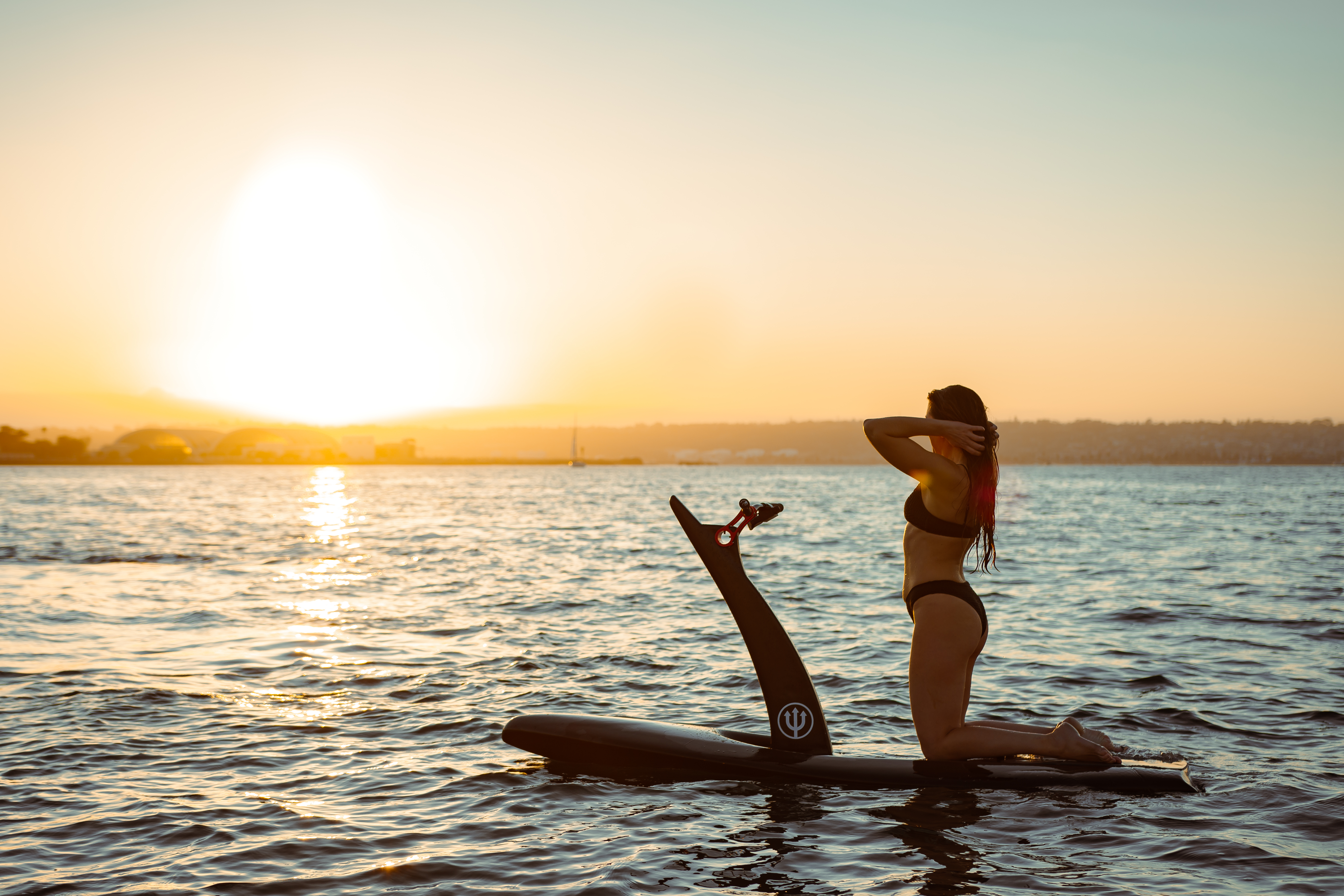 Hydrofoiler on an eFoil at sunset in Cabo San Lucas